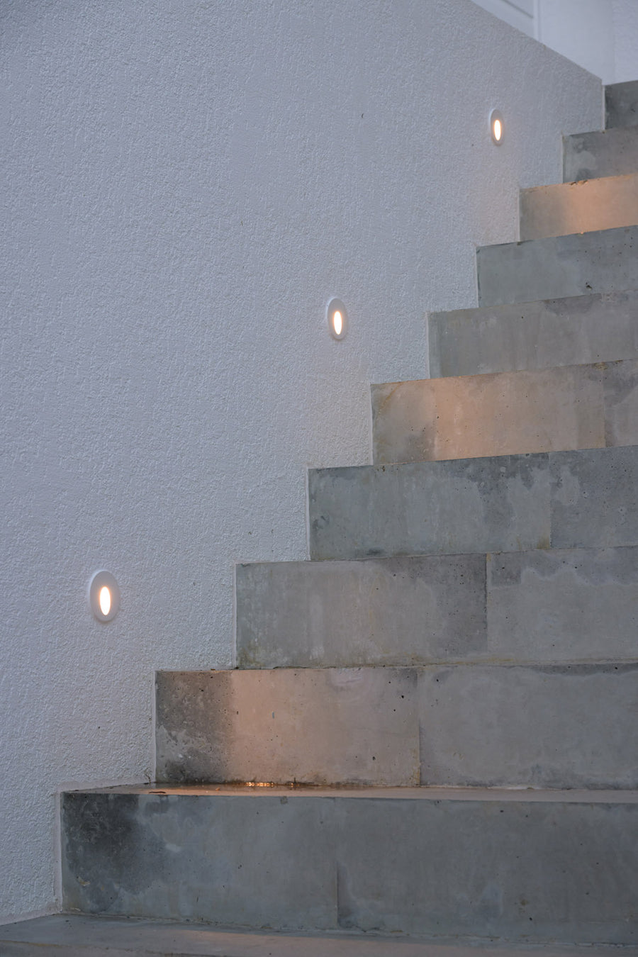 Havit Recessed LED Step Lights Along an Exterior Rendered Wall
