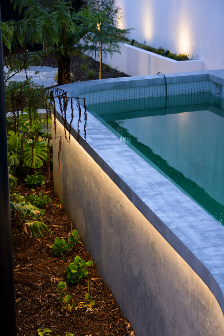 Havit LED Strip and Spike Lights Around an Elevated Pool Garden