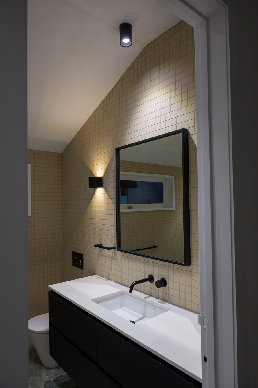 Havit Versa Wall Light and Nella Downlight in a Modern Bathroom