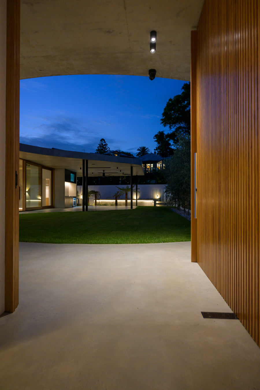 Havit Nella Black Downlights in a Luxury Concrete Archway at Dusk