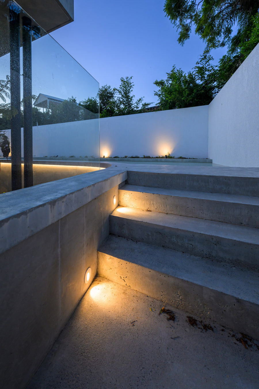 Havit Recessed Step Lights and LED Strip on Concrete Outdoor Stairs at Dusk