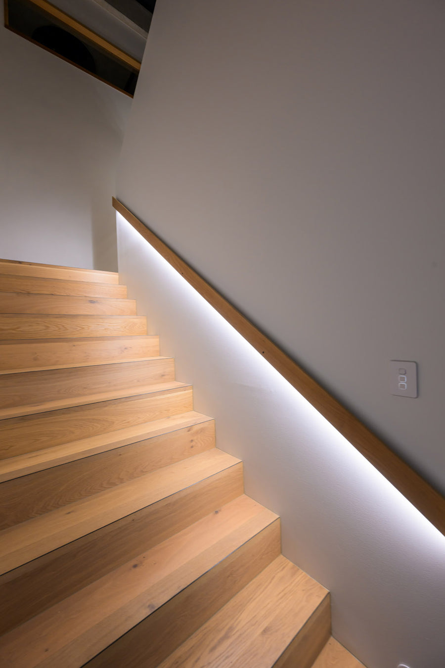 Havit LED Strip Under Timber Handrail on an Indoor Staircase