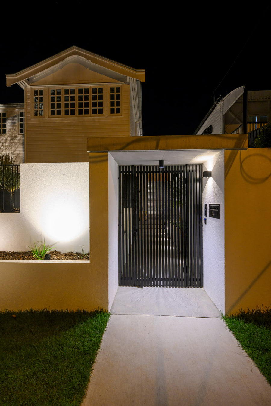 Havit Nella Downlight and Versa Wall Light at a Residential Front Gate Entry