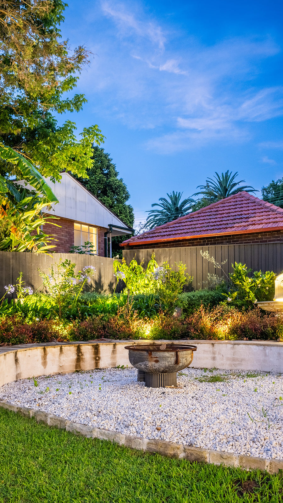 Black Garden Spike Lights Illuminating Backyard Garden Bed