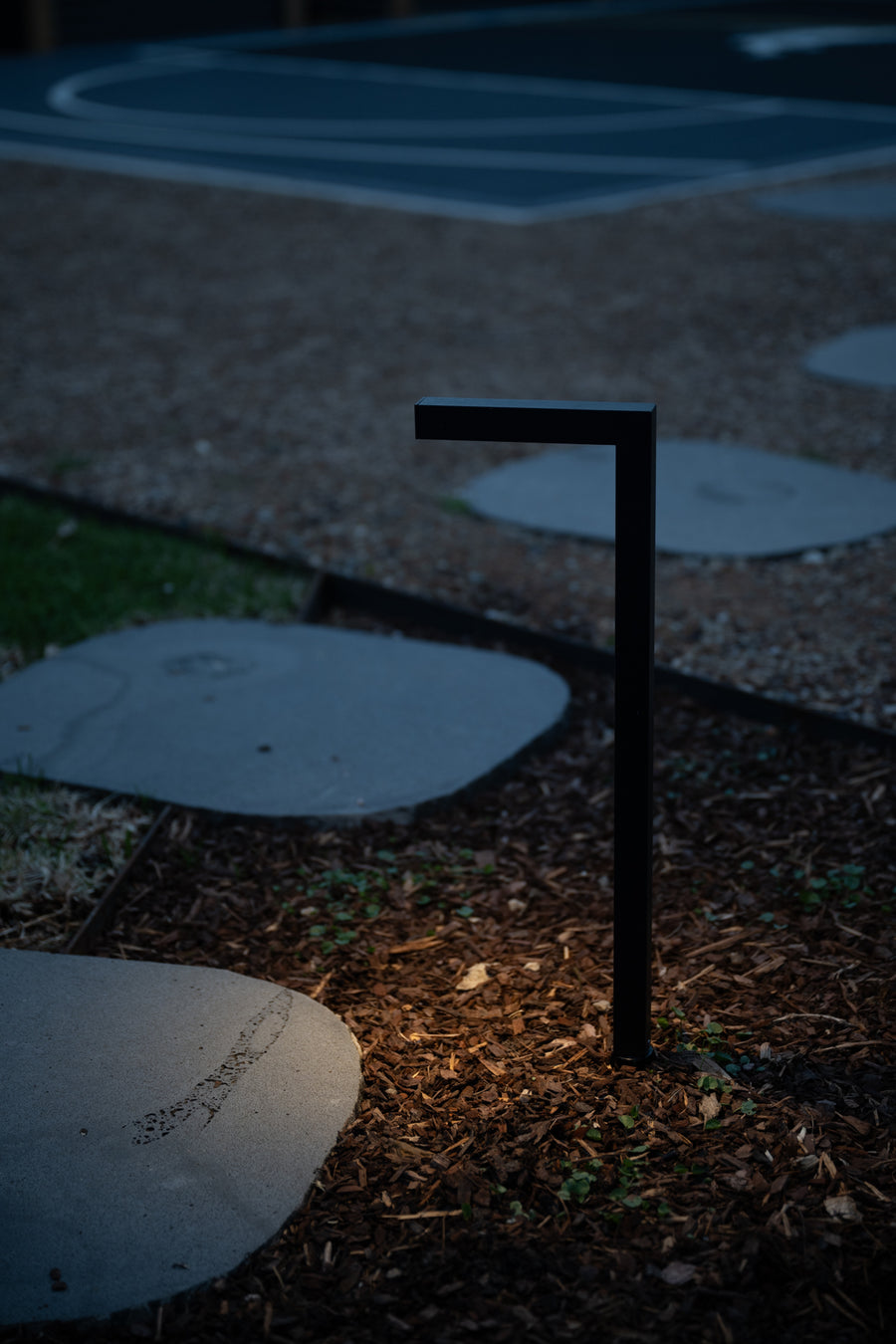 Nedia Black Garden Path Light Beside Stepping Stone Path