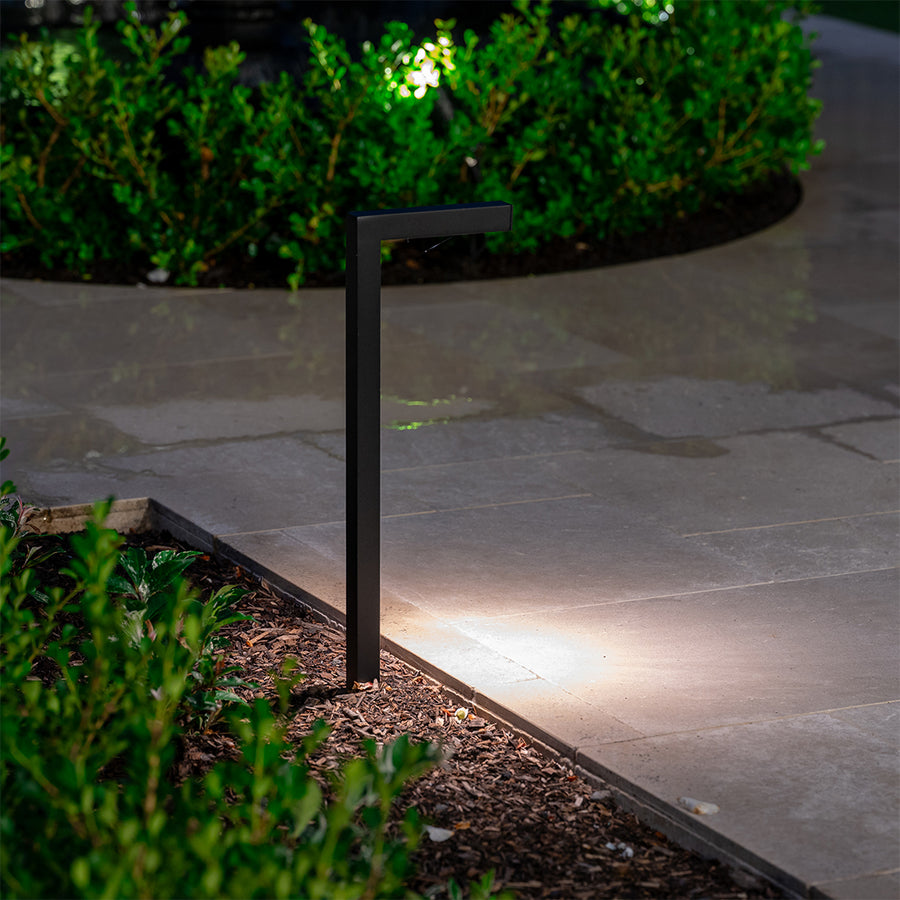 Black Garden Path Light Illuminating Paved Walkway