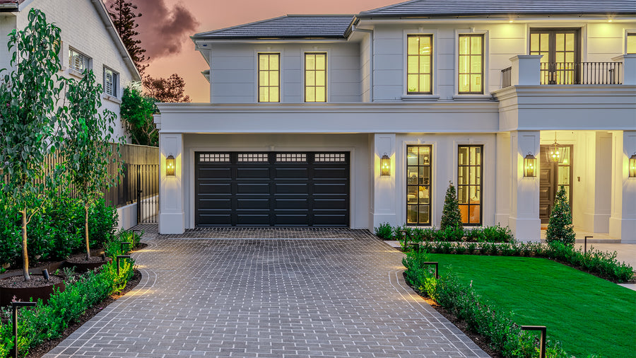 Black Garden Path Lights Framing Luxury Home Driveway