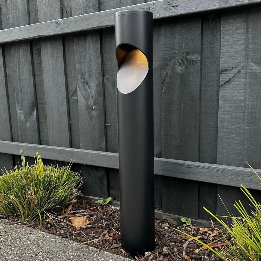 Fedor Black Round Bollard Light Beside Timber Fence