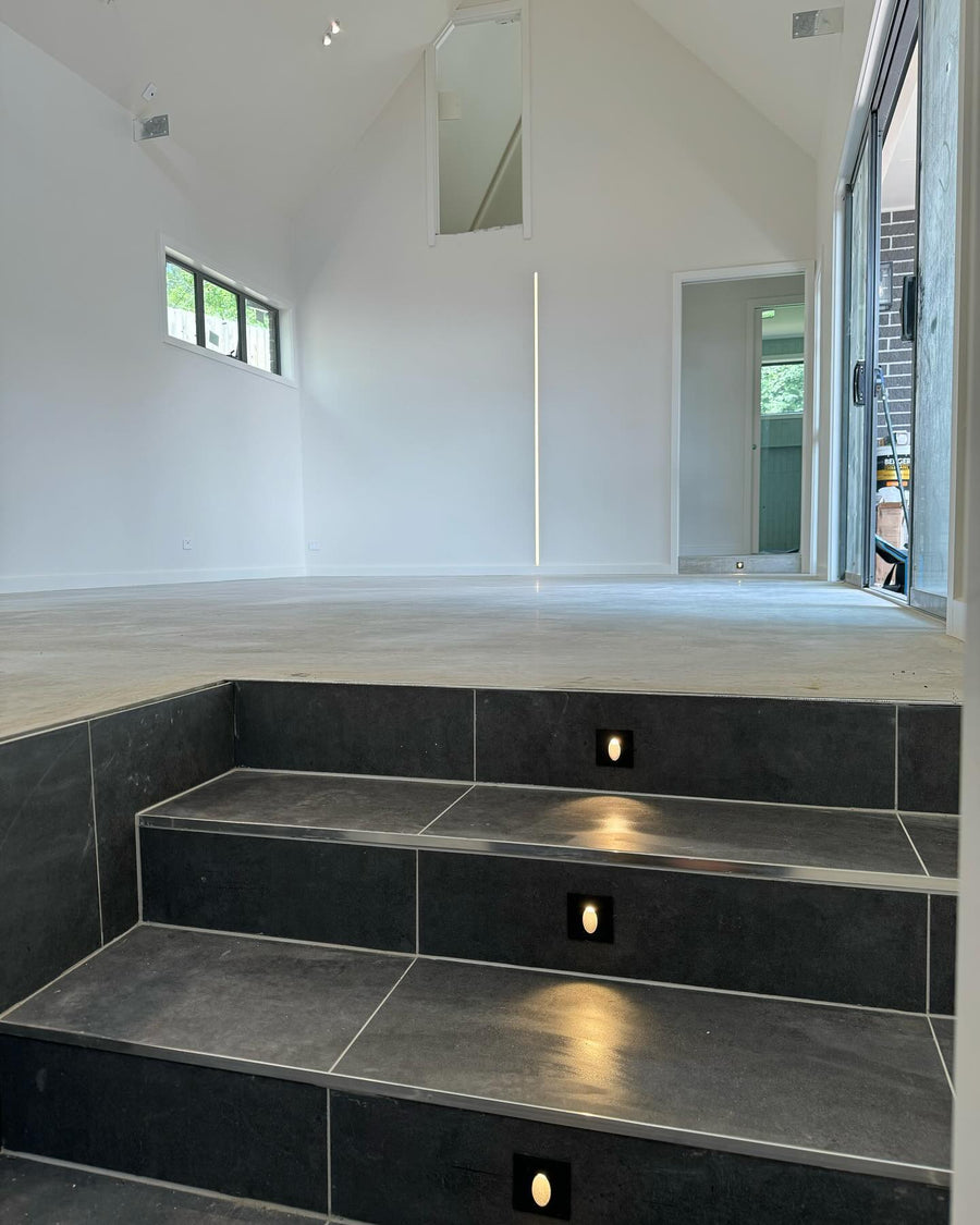 Mini Reces Black Square Step Lights Along Indoor Tiled Steps