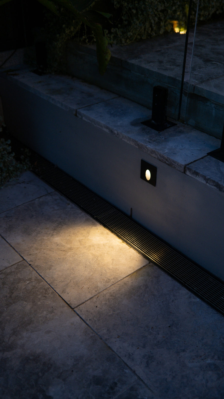Mini Reces Black Step Light on Outdoor Patio Wall