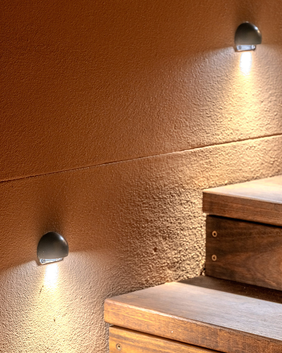 Occhio Black Eyelid Step Lights Along Timber Outdoor Steps