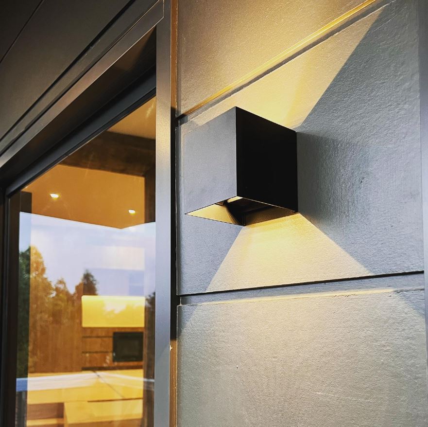 Celes Black Square Up and Down Wall Light Beside Sliding Door