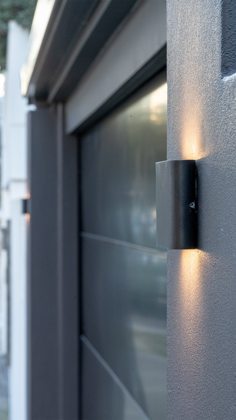 Lisse Black Up and Down Wall Light Beside Garage Door