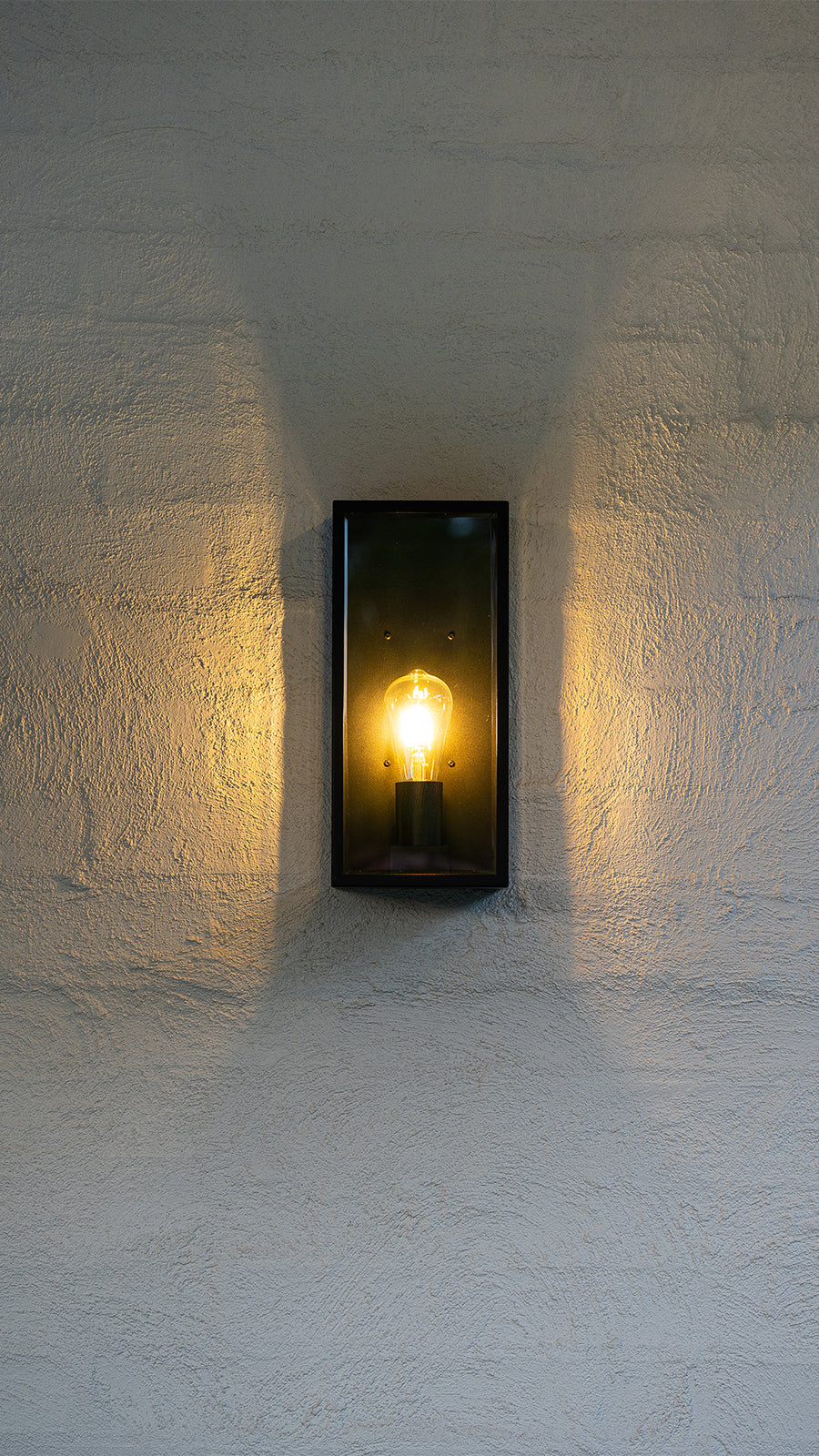 Bayside Large Black Wall Light on Rendered Exterior Wall