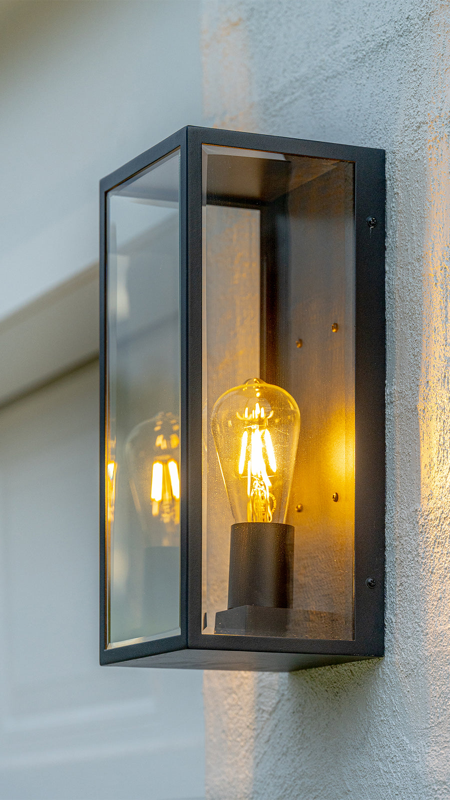 Bayside Black Wall Light Close Up on Rendered Exterior Wall