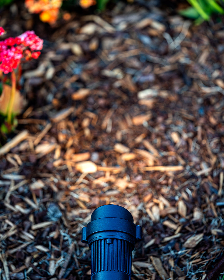 HV1428 Tivah Garden Spike Light Close Up in Mulch Garden Bed