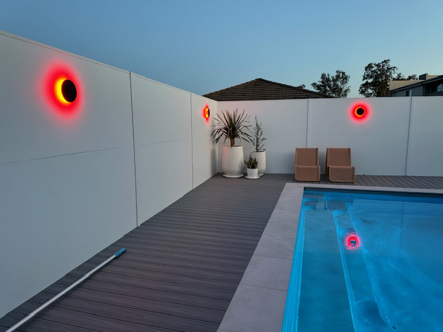 Havit Halo RGBW Outdoor Wall Lights Set to Red Around a Residential Pool