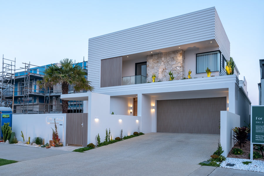 Havit Outdoor Lighting Across the Full Facade of a Modern Coastal Home