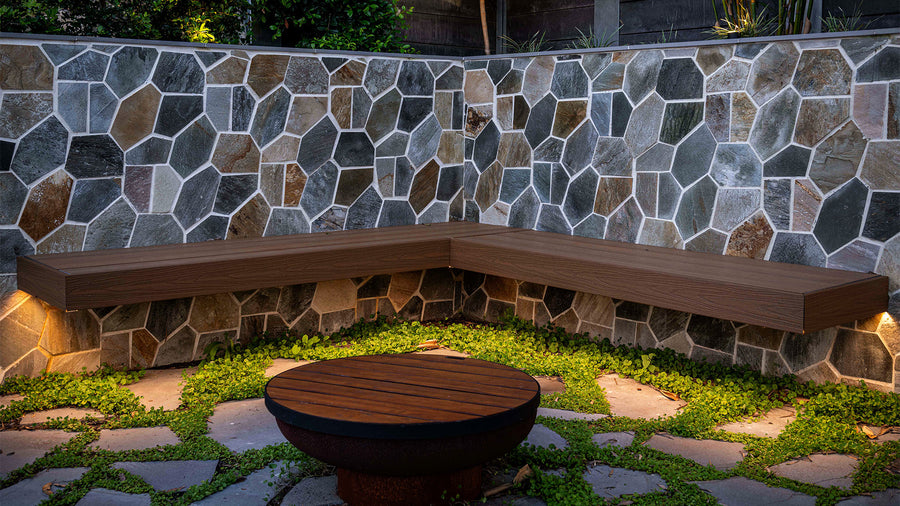 Havit LED Strip Lighting Under an Outdoor Stone Bench Seat in a Backyard