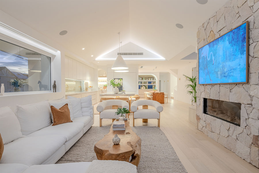 Havit LED Strip Lighting in the Raked Ceiling of a Luxury Coastal Living Room