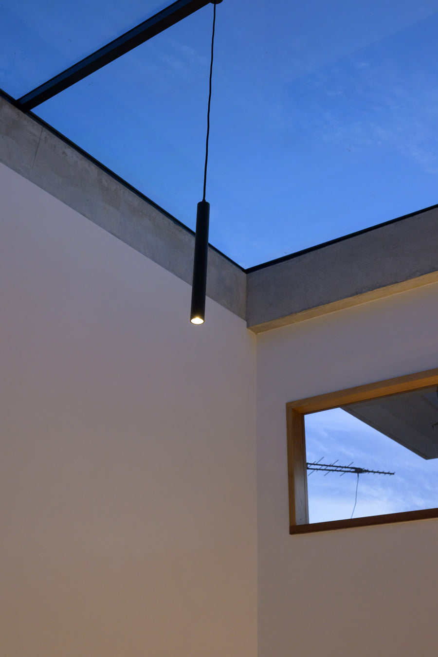 Havit Henger Black Cylinder LED Pendant Hanging from a Skylight