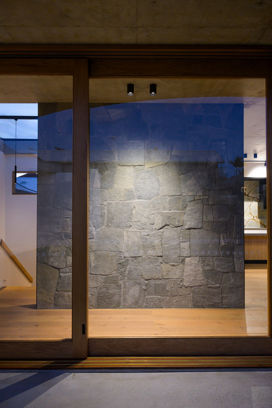 Nella Black Surface Mounted Downlights Highlighting Stone Feature Wall